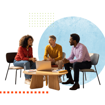 Three people having a discussion around a round wooden table with a laptop and notebooks, set against a graphic background.