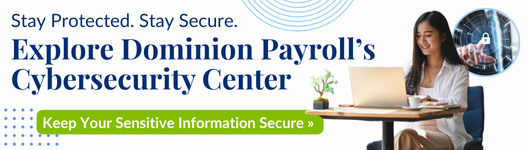 A person sitting at a desk with a computer, promoting Dominion Payroll's Cybersecurity Center for protecting sensitive information.