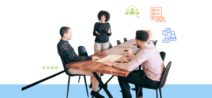 Group of four people in a meeting around a wooden table with business icons floating above them.