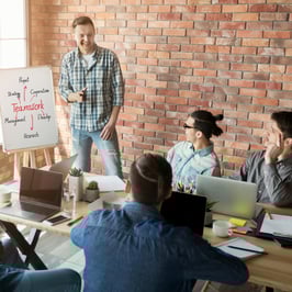 new leader conducting team meeting with colleagues